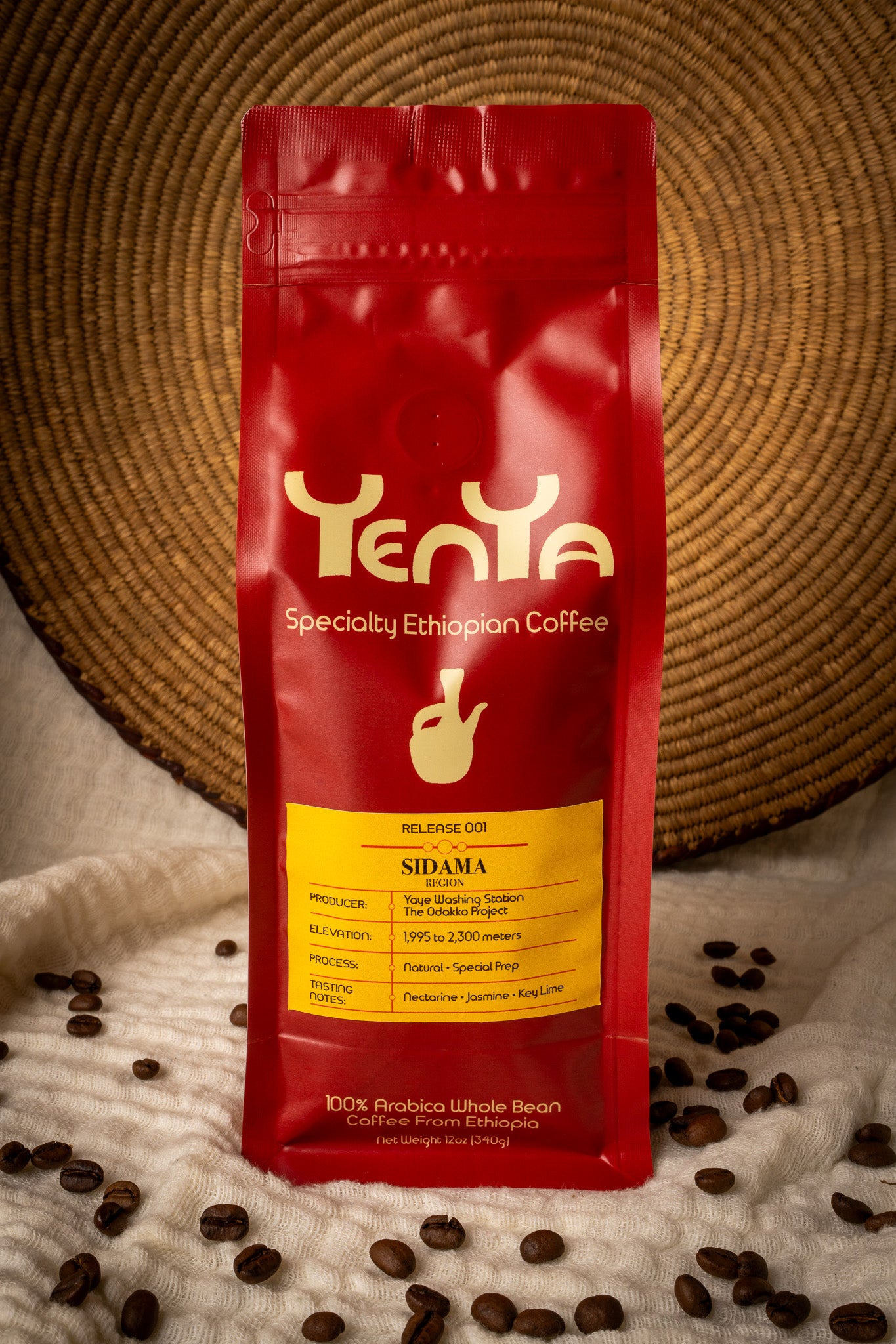 Front view of the YenYa Release 001 coffee bag framed by a woven Ethiopian basket